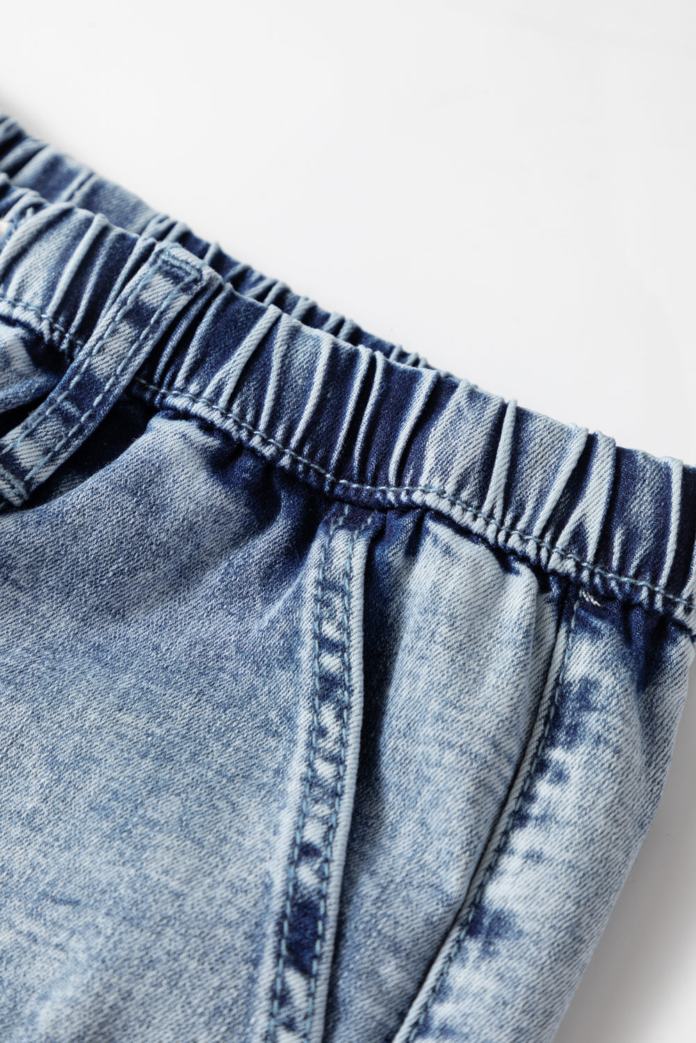 Vaqueros Ashleigh Blue de cintura alta con lavado ácido, costuras expuestas y cordón ajustable
