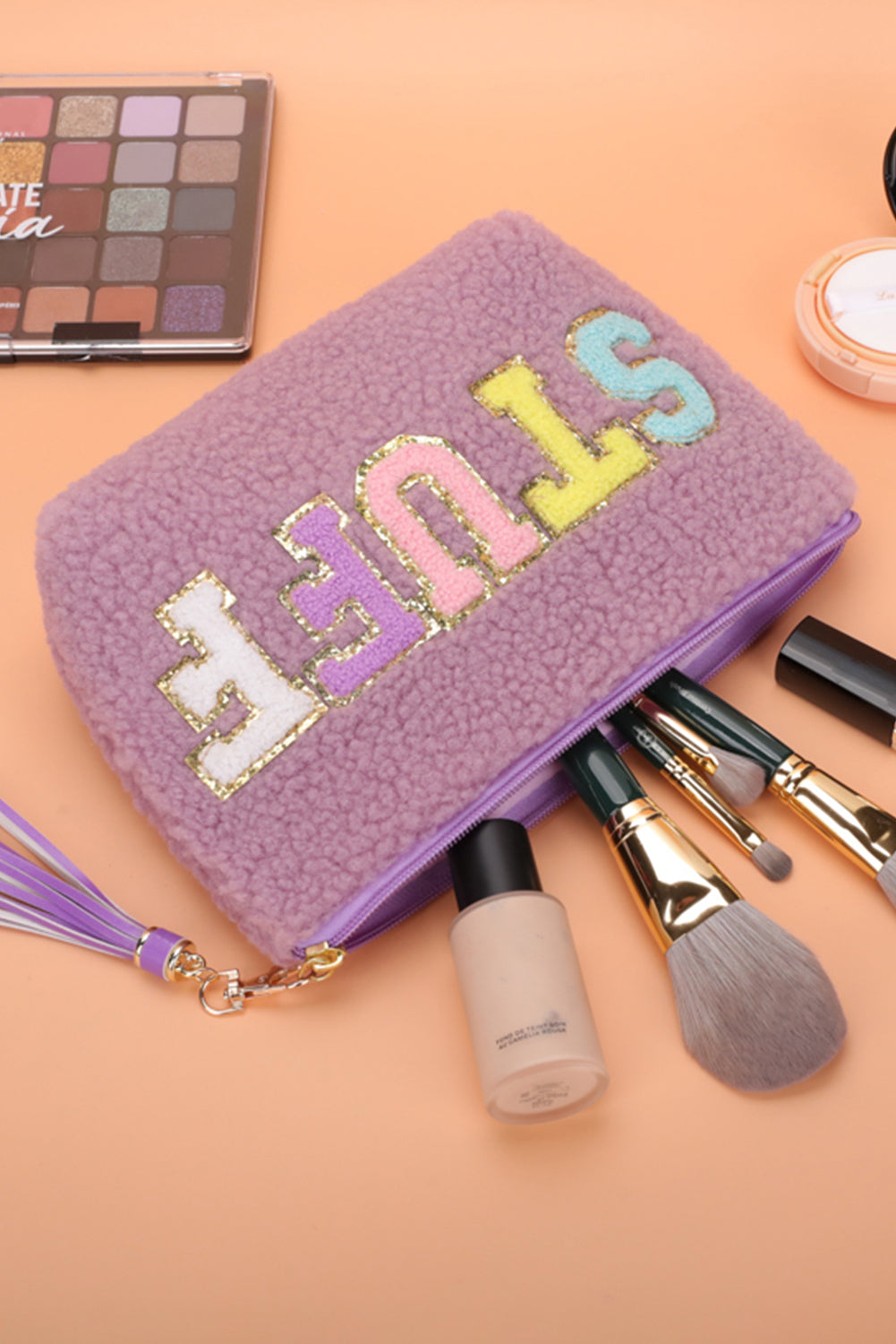 Bolsa de maquillaje con cremallera y borlas con estampado de letras brillantes de Phalaenopsis