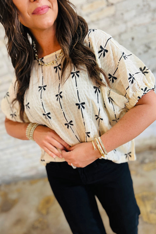Top de manga corta abullonada con estampado de lazo beige