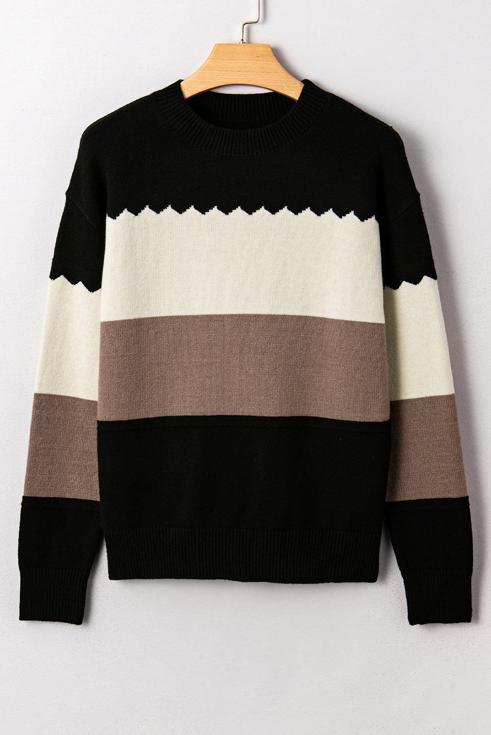 Suéter negro con cuello redondo y hombros caídos en bloques de color