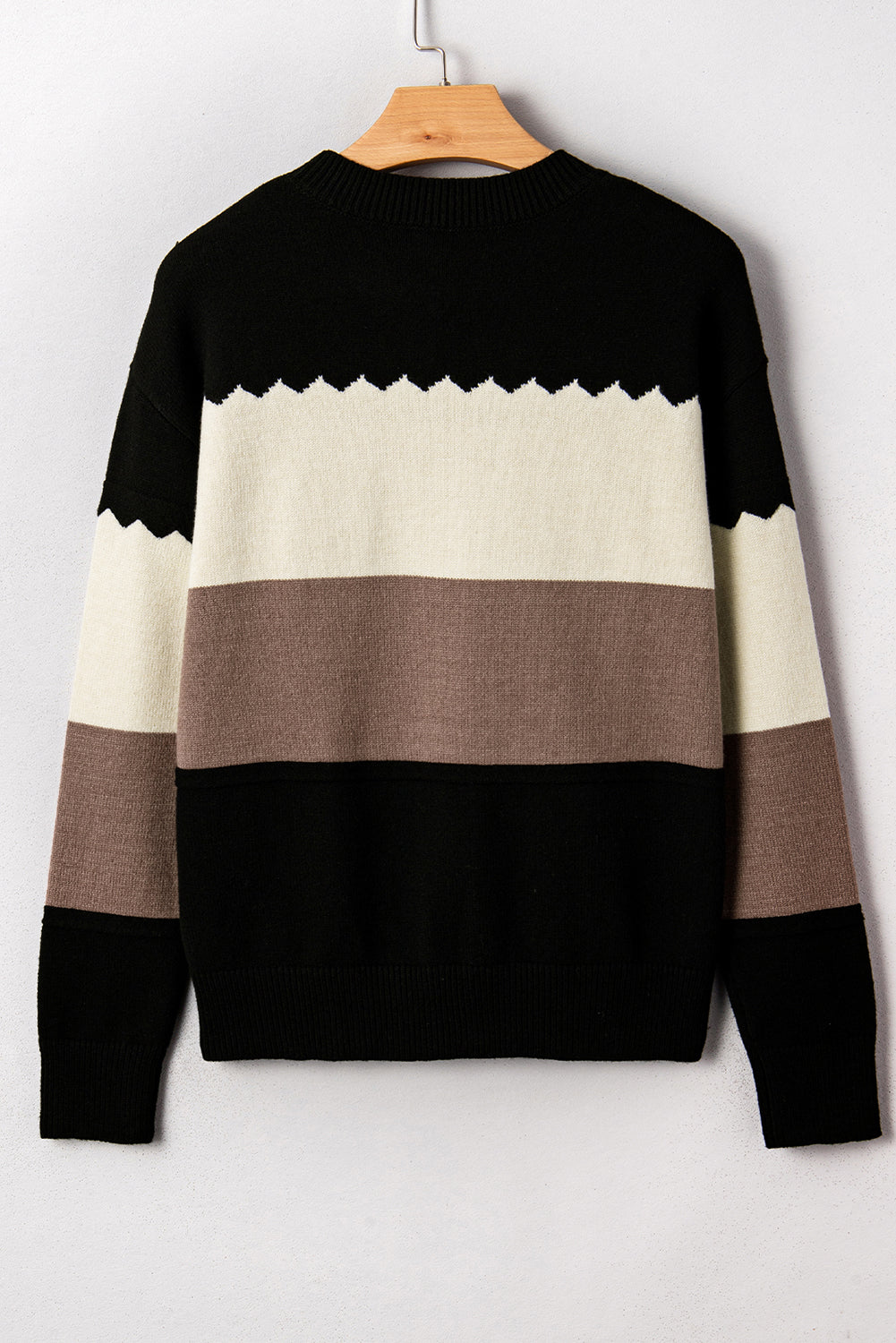 Suéter negro con cuello redondo y hombros caídos en bloques de color