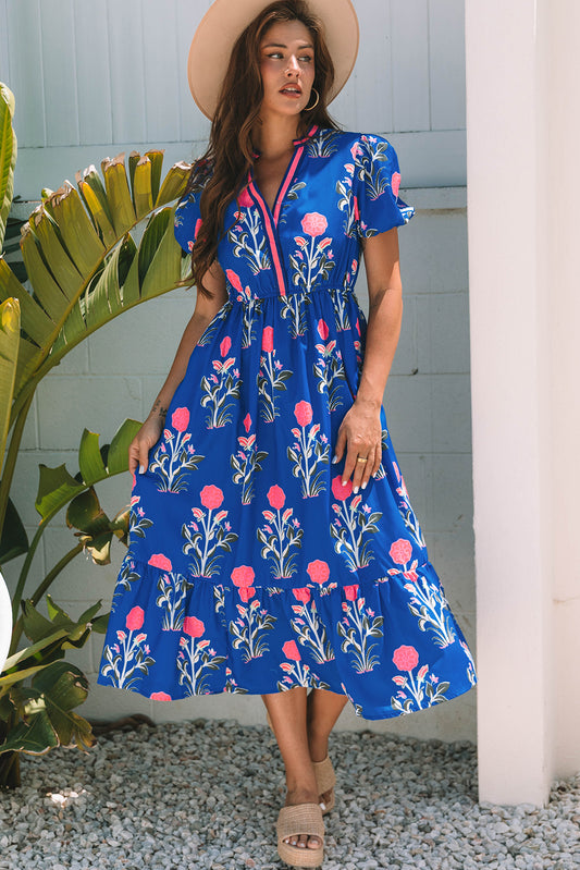 Vestido largo azul cielo con estampado floral, mangas cortas abullonadas, escote en V y cintura alta