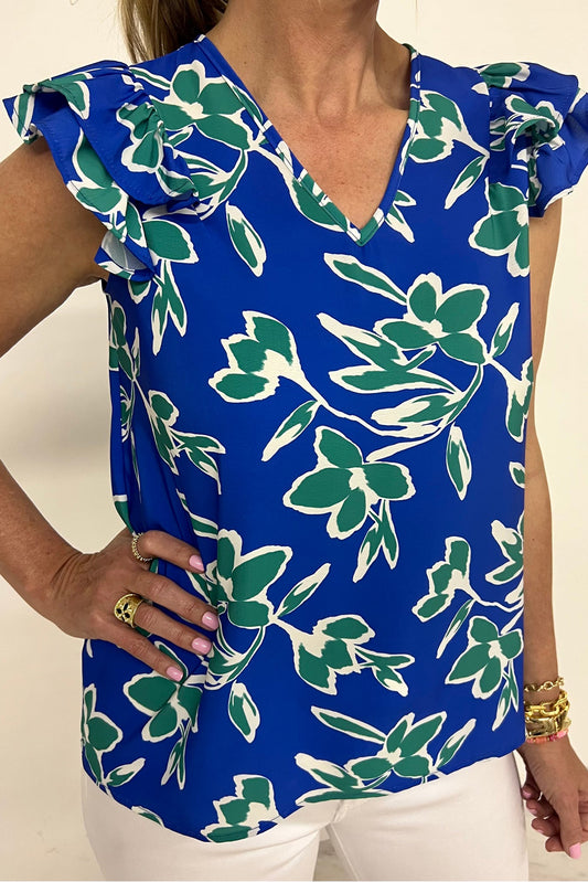 Blusa azul de manga corta con volantes, cuello en V y estampado floral