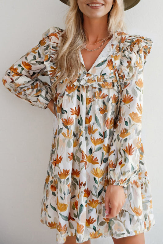 Vestido mini de manga larga con volantes, cuello anudado y estampado floral amarillo